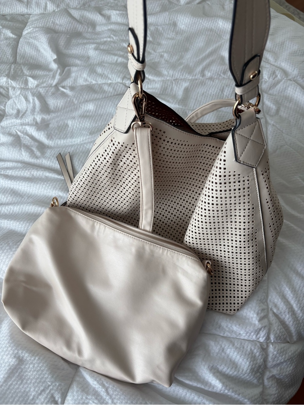 Two piece handbag set in cream colour.